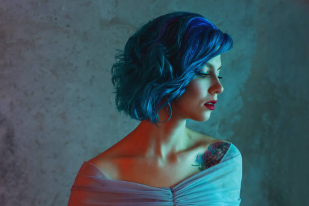 istock Blue hair woman in studio. 1700513175