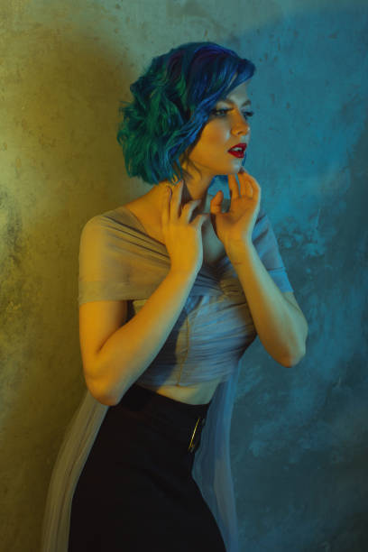 istock Blue hair woman in studio. 1700514319