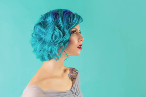 istock Blue hair woman in studio. 1700514874
