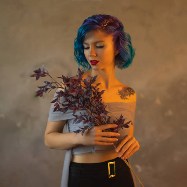 istock Blue hair woman in studio. 1700516020