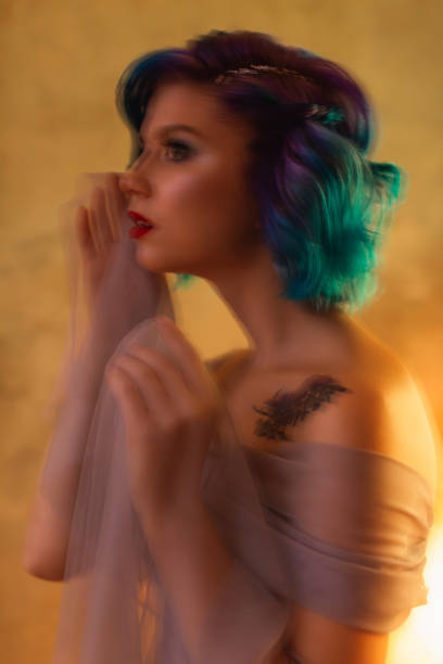 istock Blue hair woman in studio. 1700517074