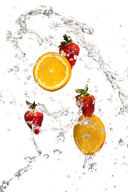 istock Strawberries and orange slices in a water splash 170052008