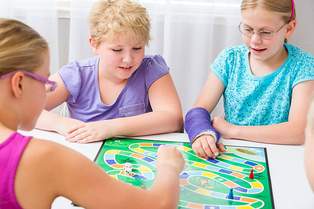 istock Group of kids playing a board game 170052131
