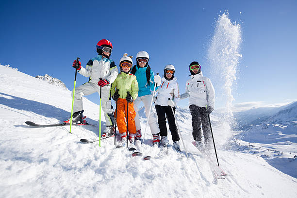 istock group of skiers with blue sky 170052429