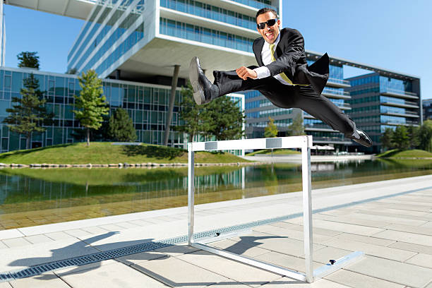istock dynamic happy young business hurdler 170052432