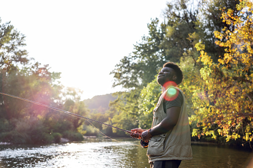 Man enjoys sunset on the river