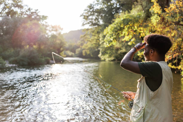 istock Fly fisherman enjoys sunset 1700527117