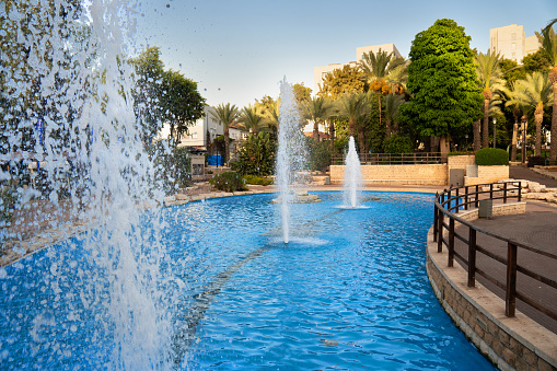 Beautiful fountains in the city park of Rishon Lezion in Israel in summer evening