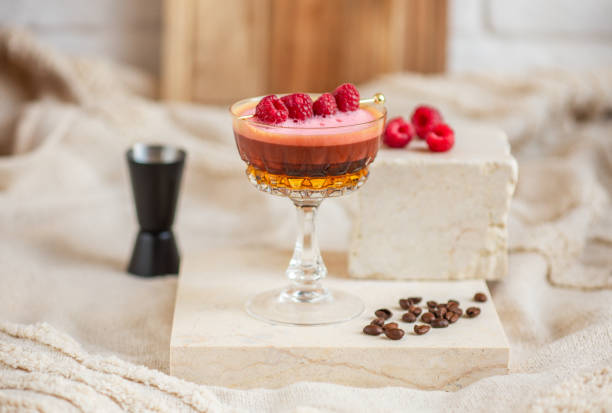 istock Espresso Coffee Cocktail martini drink with pink Raspberry foam 1700536902