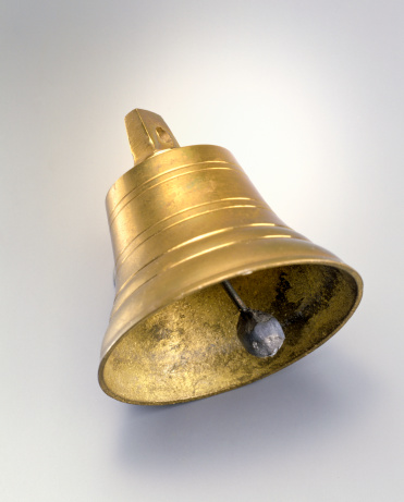 copper bell on gray/white background