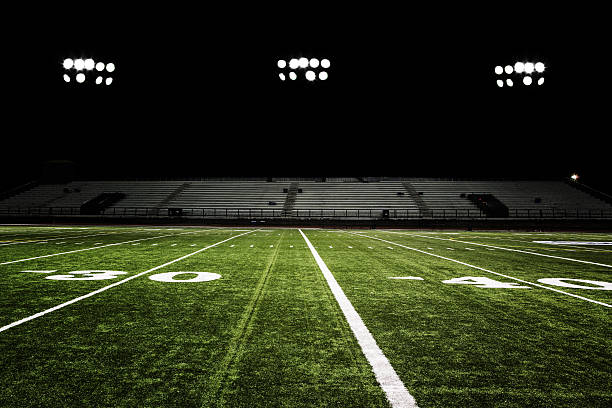 Football Field at Night  american football field photos stock pictures, royalty-free photos & images