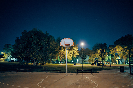 Basketball court at night at a public park