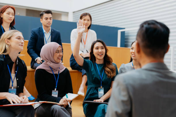 istock Asian businesswoman asking question during a seminar 1700548362