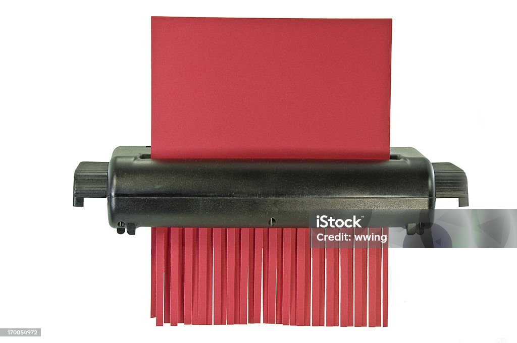 Paper Shredder With Clipping Path A paper shredder with a piece of red  paper half shredded. Clipping path Paper Shredder Stock Photo