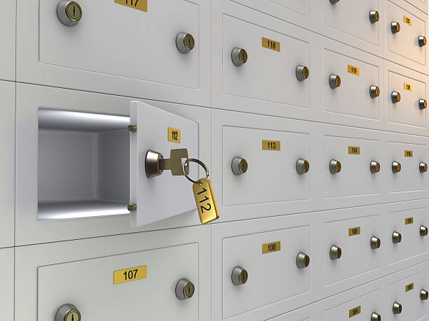 a row of safety deposit boxes with one opened - 銀行保管箱 個照片及圖片檔