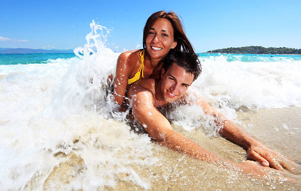 istock Smiling couple lying in the water. 170057851