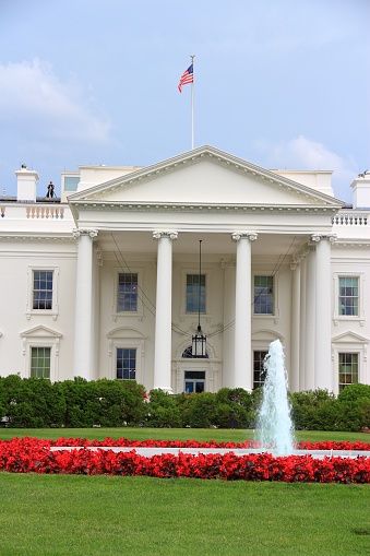 The White House in Washington D.C. United States national landmark. Small silhouette of rooftop sniper always present on the White House.