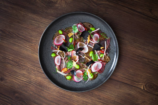 Beef carpaccio with some edible garnish