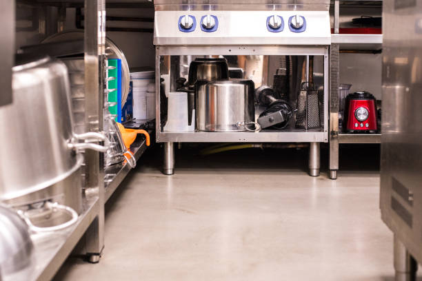 istock All steel industrial kitchen with burners and utensils 1700600439