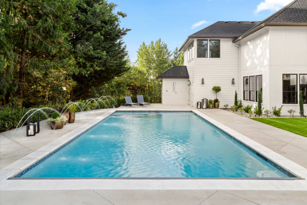 Swimming Pool in Backyard Exterior of Extraordinary Luxury Home stock photo