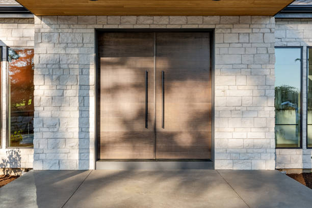 istock Double Front Doors and Covered Patio Outside  Luxury Home 1700606834