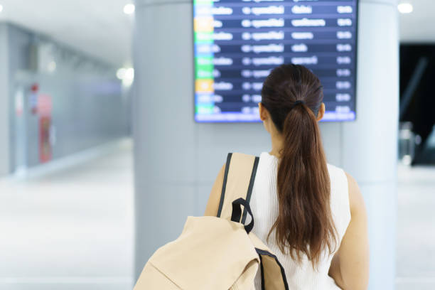istock Female passenger walking at the airport. 1700611576