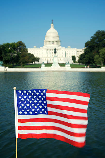 istock American Flag in front of US Capitol Building 170062148