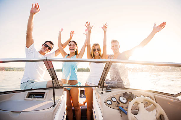 istock Cheerful couples enjoying on a speedboat ride. 170062509