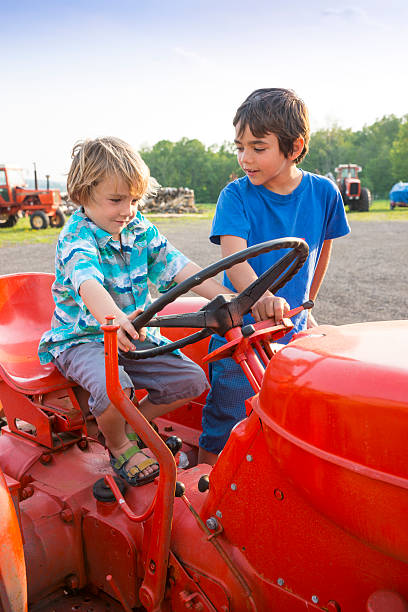 istock Two farm children on a tractor 170062609
