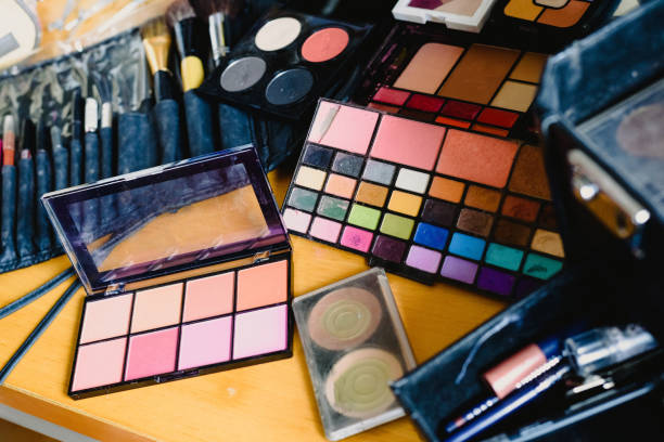 istock Cosmetics set, palette of eyeshadows, lipsticks, brushes, blush. 1700631735
