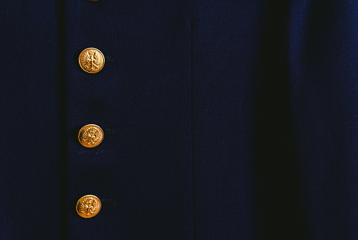 Military dress suit jacket hanging on a hanger