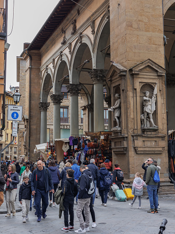 Firenze, Italy - 8 april 2023: Porcellino Market with many Tourists, ancient Covered Market in Florence, Italy.