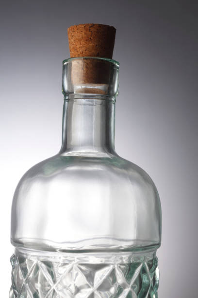 istock Glass bottle with stopper isolated on the background. 1700689354