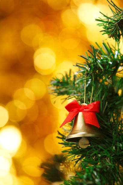 istock Christmas bell ornament on christmas tree 1700691383