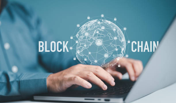 istock Businessman using computer for Blockchain technology with a chain of encrypted blocks to secure cryptocurrencies and bitcoin for online payments and money transaction to other people across the world. 1700693303