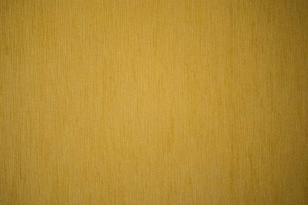 istock yellow abstract texture of a wall 1700695248
