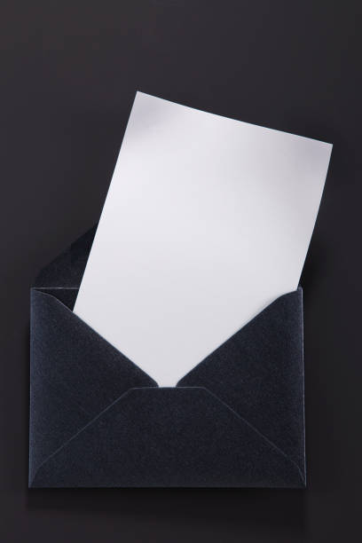 istock black envelope with paper isolated gray background 1700695479