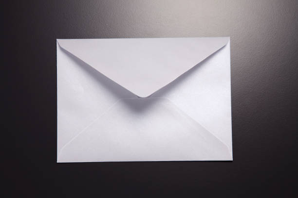 istock back view  of white envelope against a gray background 1700696010