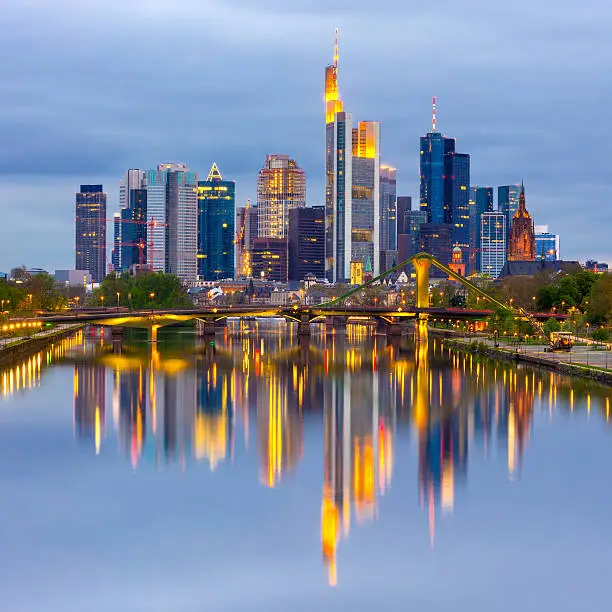 Looking down the river main at the skyline of Frankfurt at dusk, Hessen, Germany.