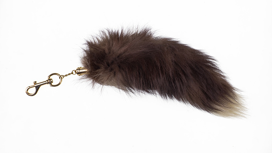 keychain with fur tail isolated on white background