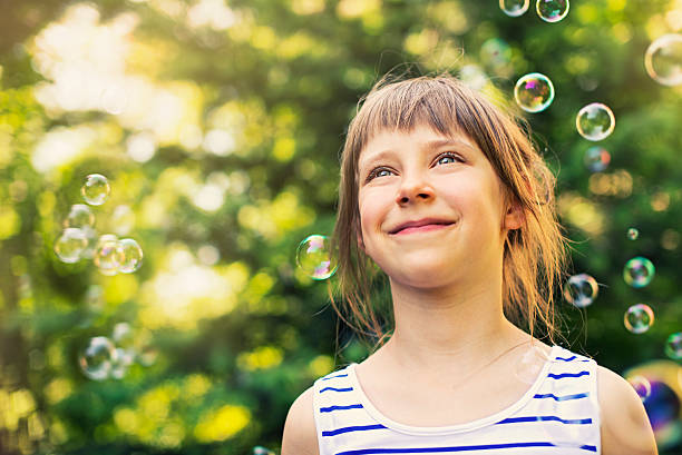 istock Happy little girl and bubbles 170070115