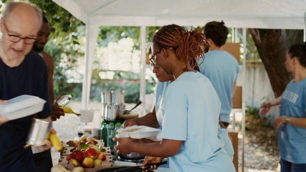 istock Volunteers Provide Food To Combat Hunger 1700704857