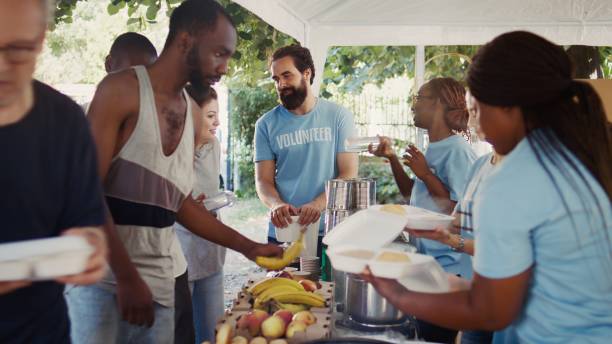 istock Volunteers Supporting The Poor And Needy 1700706024