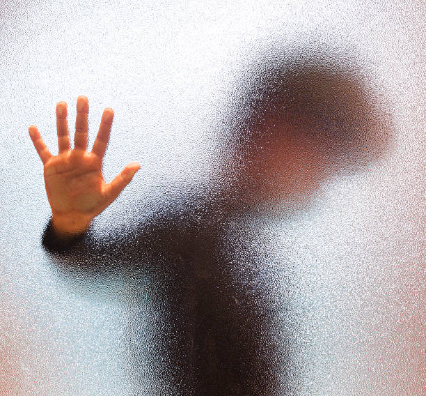 istock Boy Behind Glass Door 170071328