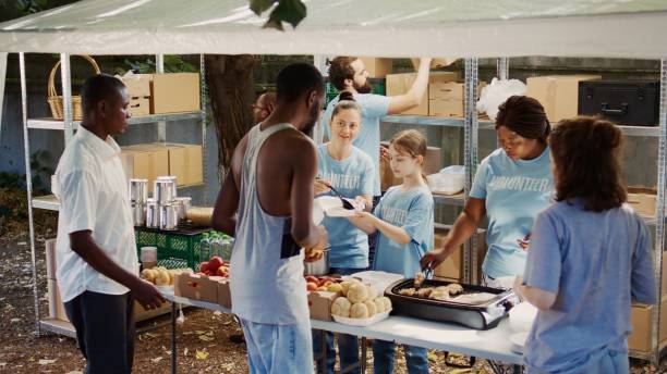 istock Volunteers Give Back At Food Drive Event 1700715063