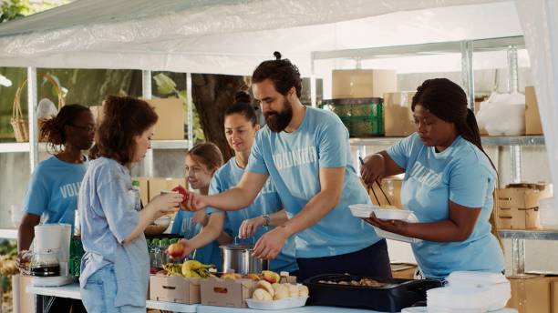 istock Volunteers Aiding The Underprivileged 1700720587