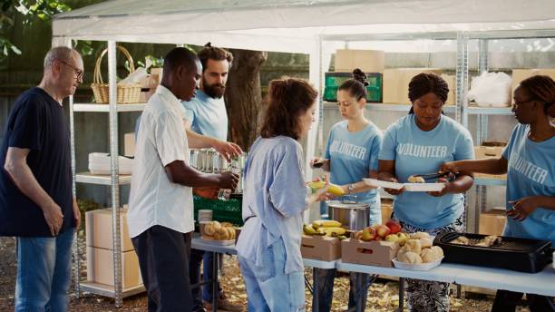 istock Less Privileged People Receive Free Food 1700720666