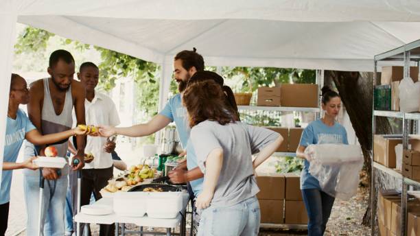 istock Less Fortunate Assisted At Food Drive 1700726148