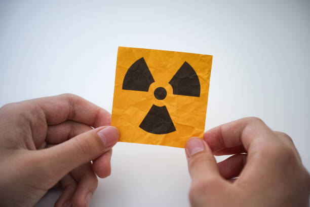 istock A young man holding a radiation warning sign in his hands 1700728940