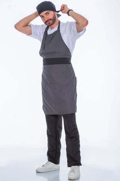istock Doctor in a white photo studio modeling his anti-fluid uniforms. 1700731260